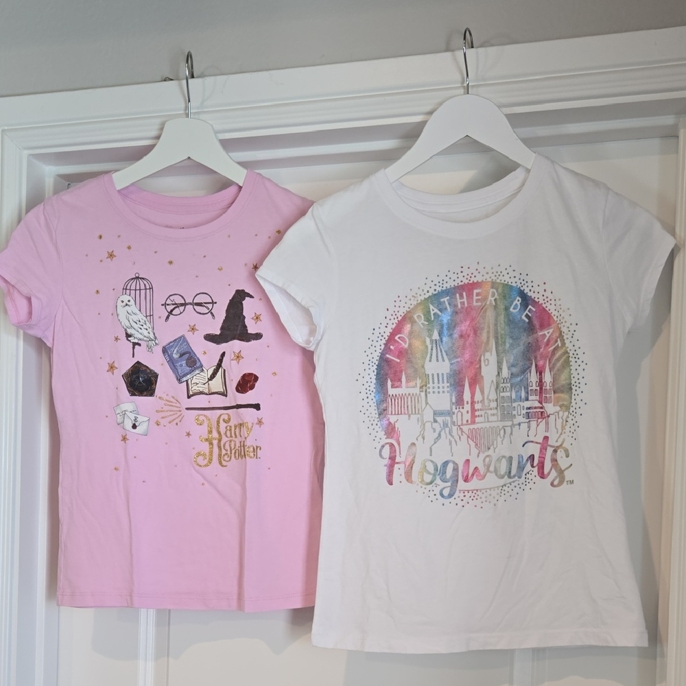 Harry Potter Pink T-Shirt and White Hogwarts T-Shirt. Both Size L (10-12) Girls.